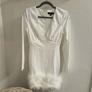 Lulus brand size small- white long sleeve mini dress with feather detail bottom